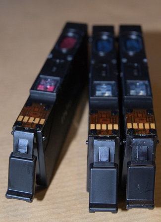 Printer cartridges showing copper colored contacts